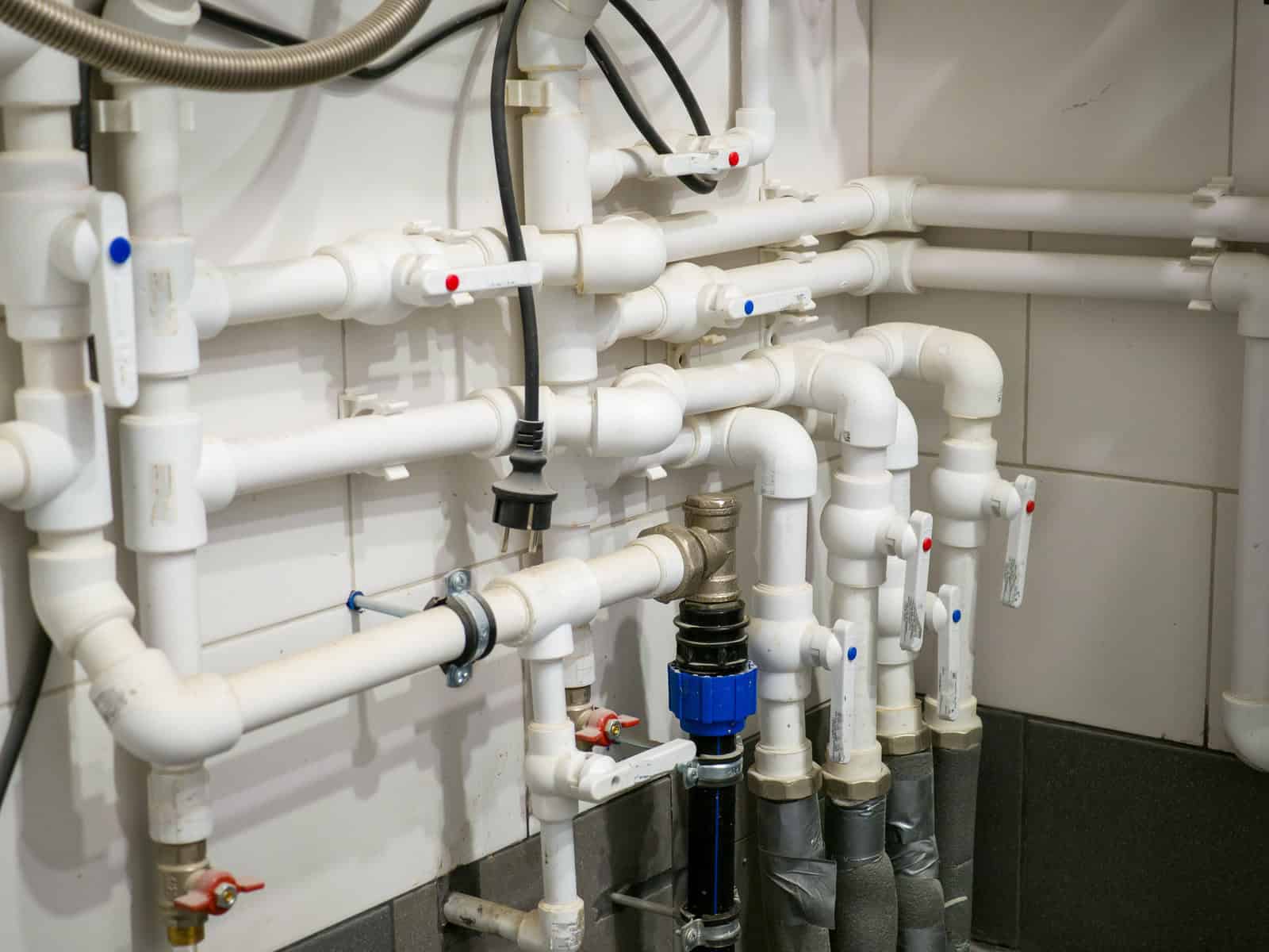 Assembly of plastic ball valves installed on water pipes. commercial plumbing